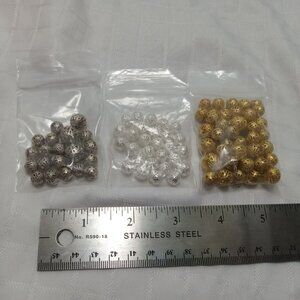 + 100 gold, silver, and platinum colored metal lace beads